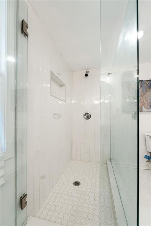 bathroom featuring a shower stall