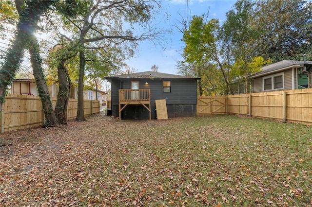 back of house featuring a fenced backyard