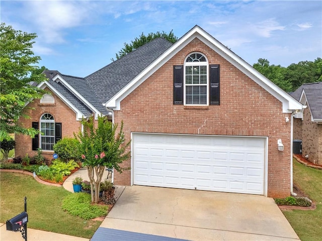 front facade with a front lawn and a garage