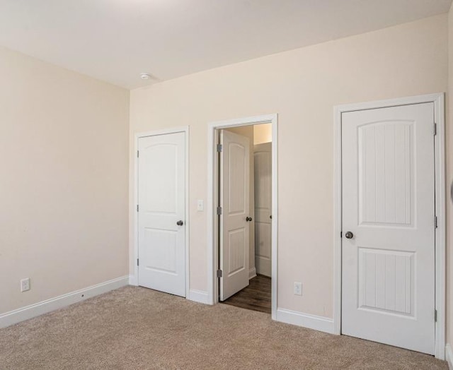 unfurnished bedroom with carpet