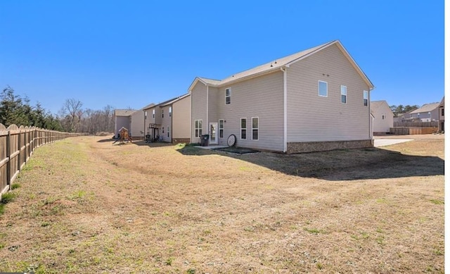 view of side of property featuring a lawn