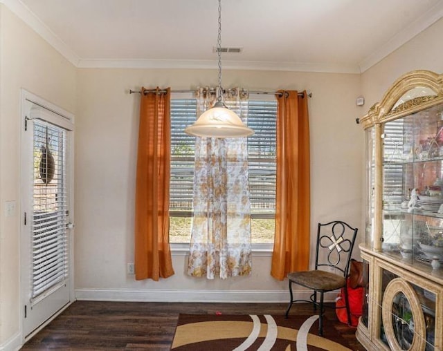 living area with an inviting chandelier, dark hardwood / wood-style floors, and crown molding