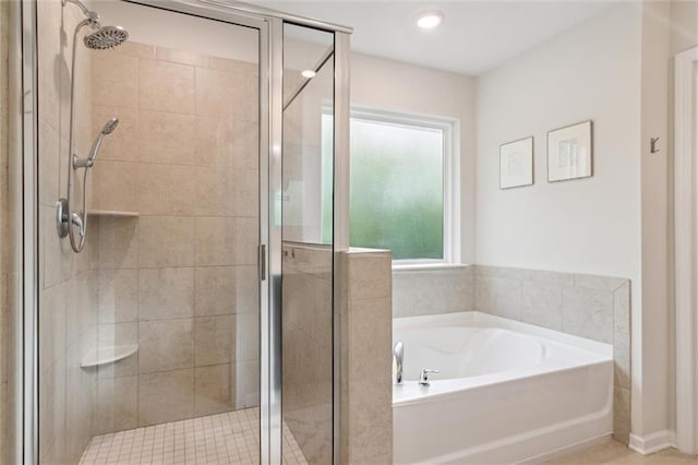 bathroom with a garden tub and a stall shower