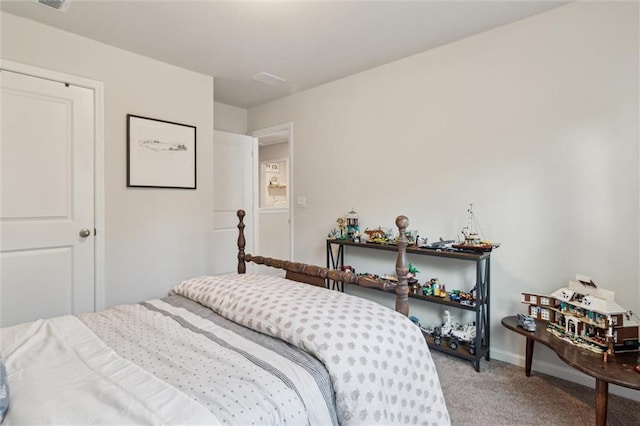 bedroom with baseboards and light carpet