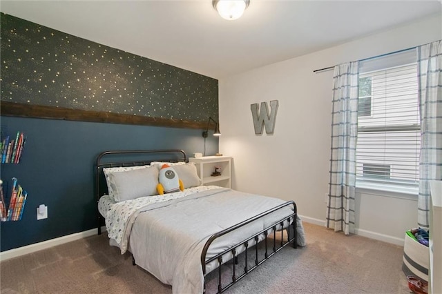 bedroom featuring carpet floors and baseboards