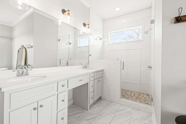 bathroom with walk in shower and vanity