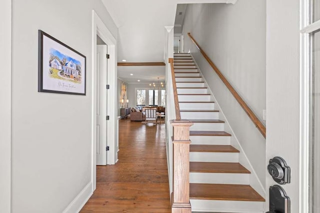 stairs featuring wood-type flooring