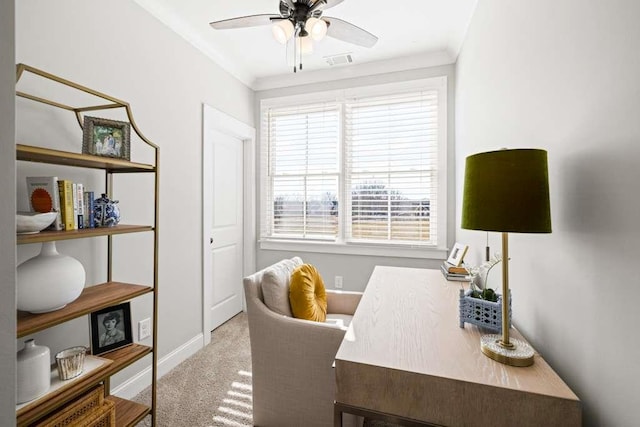 office with crown molding, ceiling fan, and light carpet