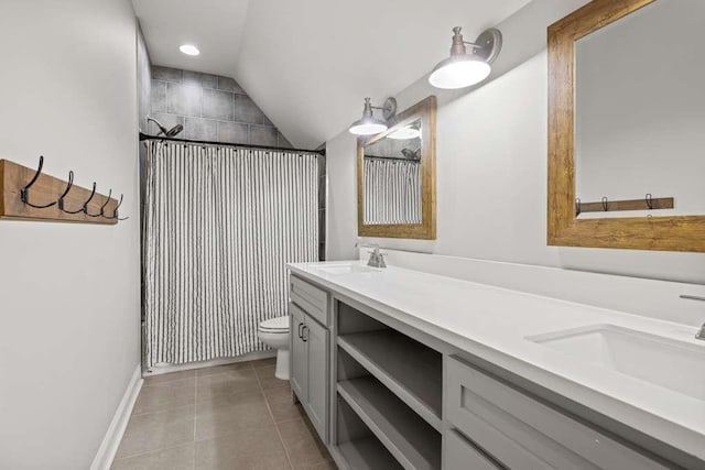 bathroom featuring tile patterned floors, toilet, a shower, vaulted ceiling, and vanity