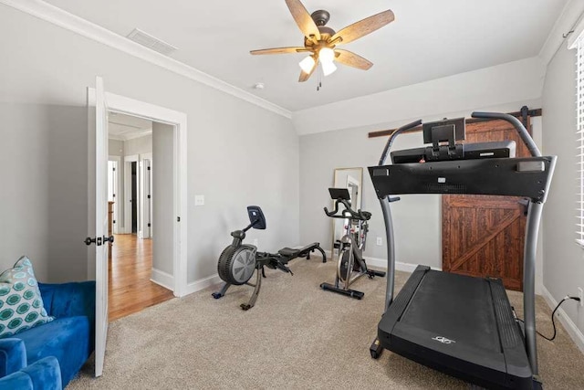 exercise room featuring light colored carpet, ornamental molding, and ceiling fan