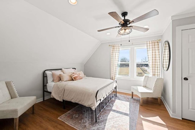 bedroom with lofted ceiling, hardwood / wood-style flooring, and ceiling fan