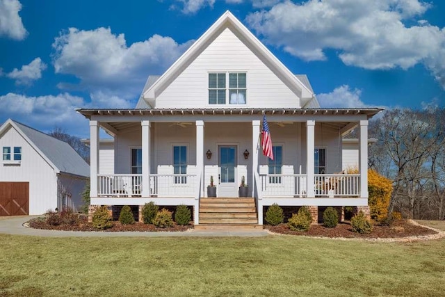 view of front of house with covered porch and a front lawn