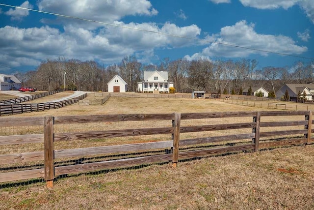 view of yard with a rural view