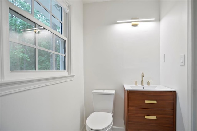 3480 Mount Olive Rd, Atlanta, GA 30344 - bathroom with vanity, toilet, and baseboards