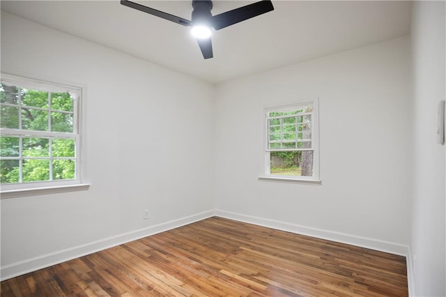 3480 Mount Olive Rd, Atlanta, GA 30344 - unfurnished room featuring ceiling fan, baseboards, plenty of natural light, and wood finished floors