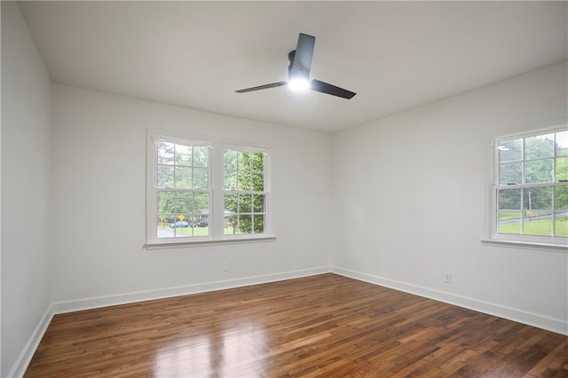3480 Mount Olive Rd, Atlanta, GA 30344 - empty room featuring a ceiling fan, dark wood-style floors, and baseboards