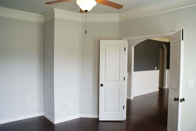 4020 Alligator Pt, Cumming, GA 30028 - empty room featuring crown molding, ceiling fan, dark wood-style flooring, baseboards, and arched walkways
