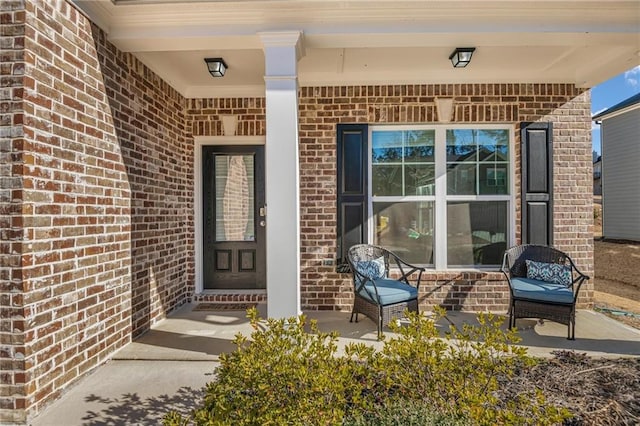 entrance to property featuring a porch