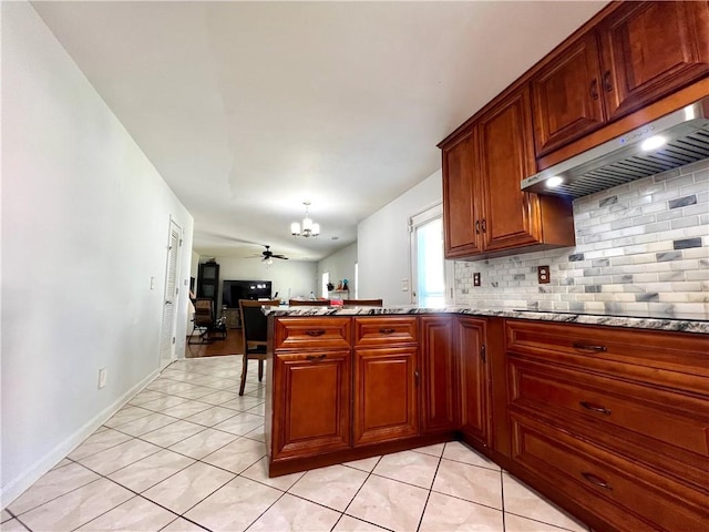 kitchen with ceiling fan, kitchen peninsula, black electric stovetop, light tile patterned floors, and exhaust hood