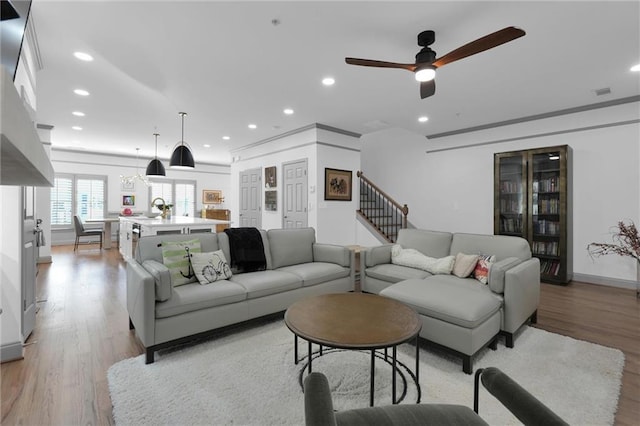 208 Wade Creek Rd, Alpharetta, GA 30009 - living area with light wood-style flooring, recessed lighting, ceiling fan, baseboards, and stairway