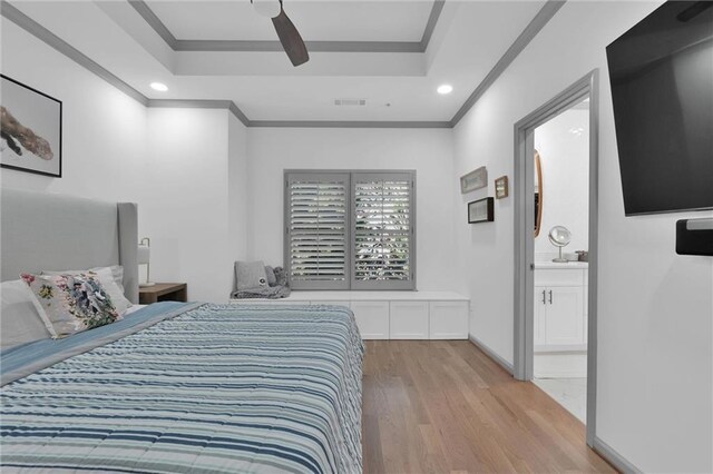 208 Wade Creek Rd, Alpharetta, GA 30009 - bedroom with a raised ceiling, light wood-style floors, ornamental molding, recessed lighting, and connected bathroom