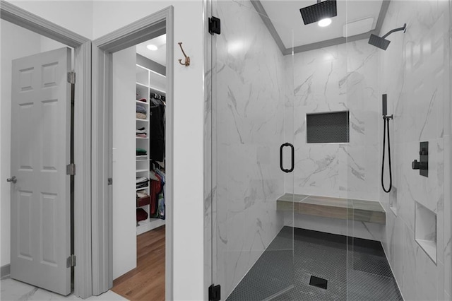 208 Wade Creek Rd, Alpharetta, GA 30009 - bathroom with a marble finish shower, a walk in closet, and recessed lighting