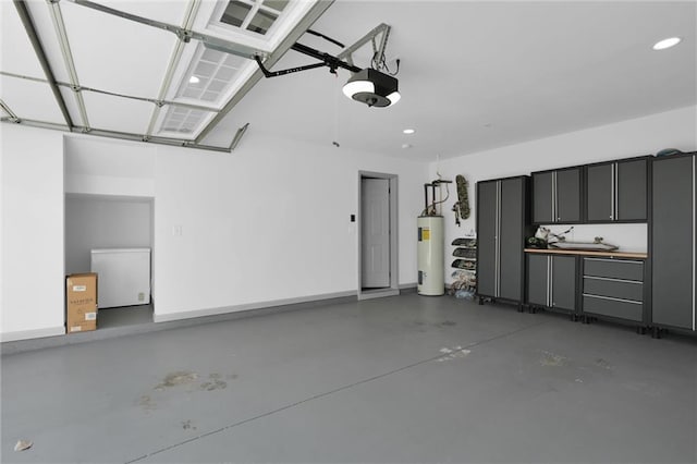 208 Wade Creek Rd, Alpharetta, GA 30009 - garage featuring water heater, a garage door opener, and recessed lighting