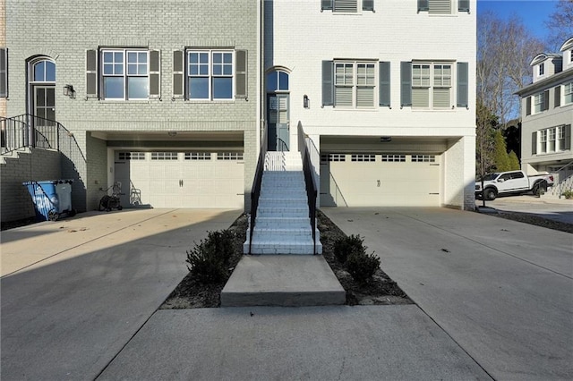 208 Wade Creek Rd, Alpharetta, GA 30009 - view of front of home with an attached garage, driveway, and brick siding
