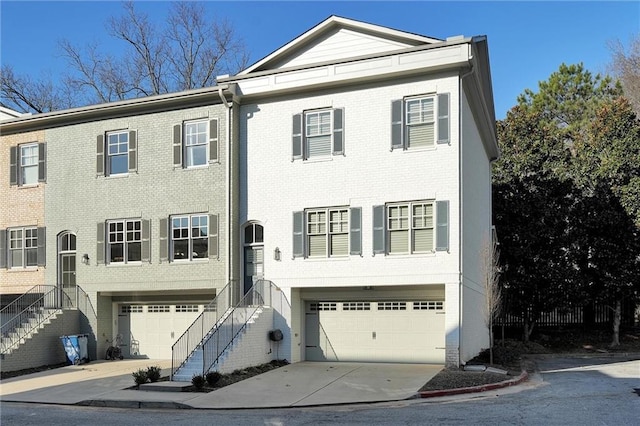 208 Wade Creek Rd, Alpharetta, GA 30009 - view of front of property with an attached garage, concrete driveway, and stairway