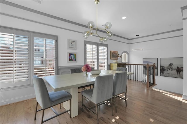 208 Wade Creek Rd, Alpharetta, GA 30009 - dining room with a chandelier, wood finished floors, and wainscoting