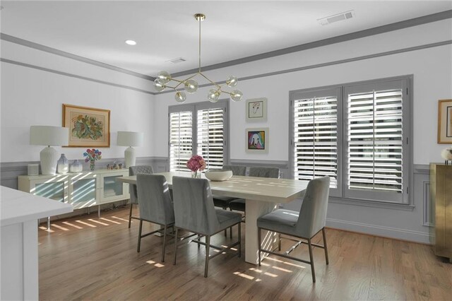 208 Wade Creek Rd, Alpharetta, GA 30009 - dining room featuring wainscoting, a chandelier, and wood finished floors