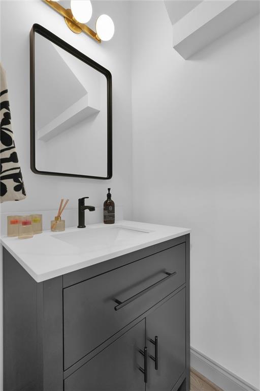 208 Wade Creek Rd, Alpharetta, GA 30009 - bathroom featuring vanity and baseboards