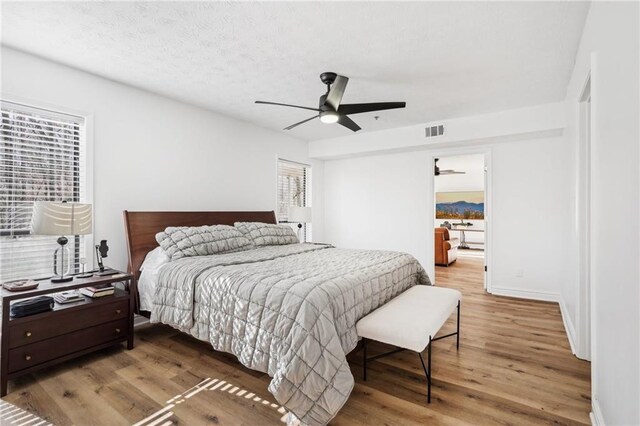 workout area with hardwood / wood-style floors