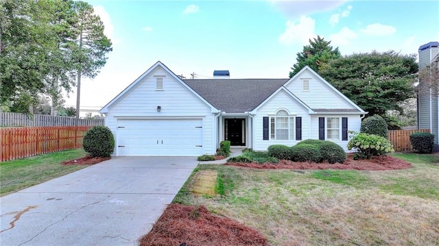 ranch-style home with a front yard and a garage