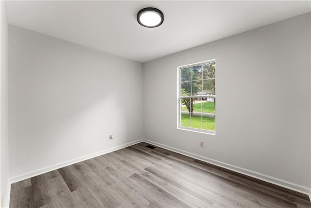 60 Weeping Willow Ln, Dawsonville, GA 30534 - spare room featuring wood finished floors and baseboards