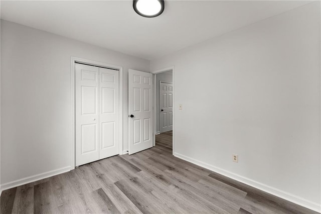 60 Weeping Willow Ln, Dawsonville, GA 30534 - unfurnished bedroom with wood finished floors, baseboards, and a closet