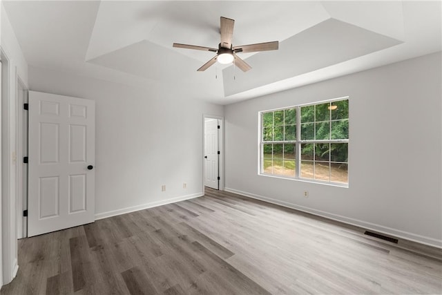 60 Weeping Willow Ln, Dawsonville, GA 30534 - spare room featuring wood finished floors, a tray ceiling, ceiling fan, and baseboards