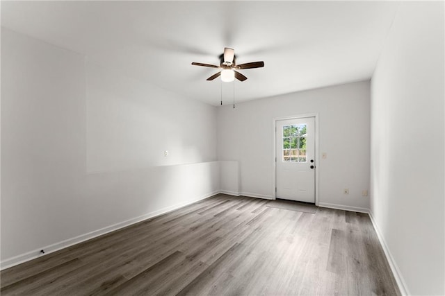 60 Weeping Willow Ln, Dawsonville, GA 30534 - empty room with wood finished floors, a ceiling fan, and baseboards