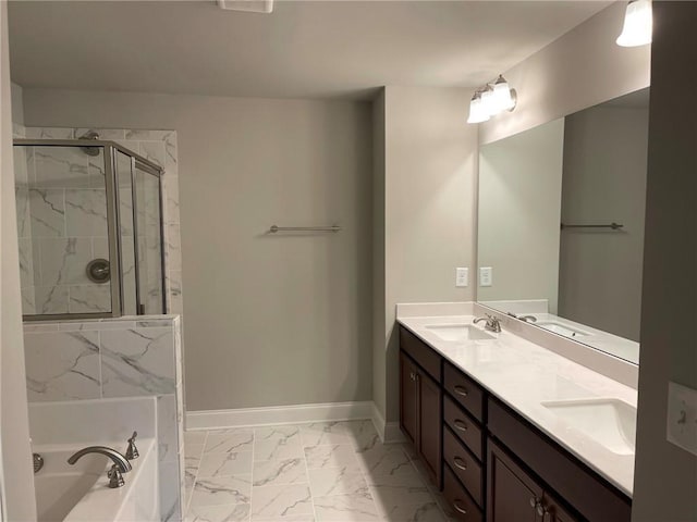 bathroom with a shower stall, a sink, baseboards, a bath, and marble finish floor