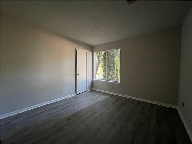 33 Drew Ct, Jonesboro, GA 30238 - empty room with dark wood finished floors and baseboards