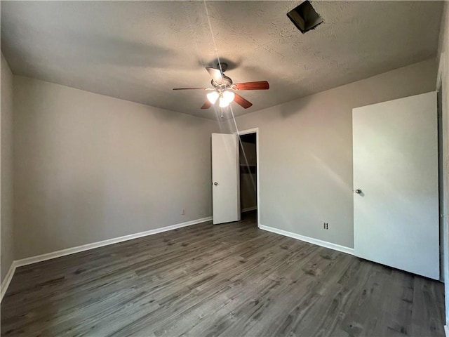 33 Drew Ct, Jonesboro, GA 30238 - unfurnished bedroom featuring wood finished floors, a textured ceiling, a closet, and a ceiling fan