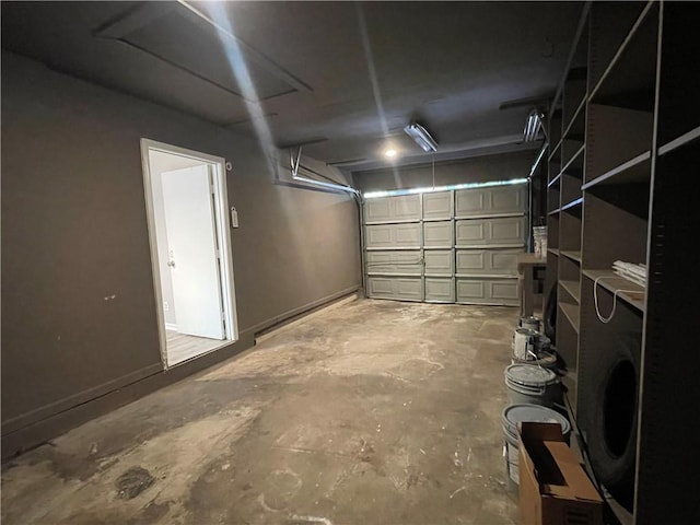 33 Drew Ct, Jonesboro, GA 30238 - garage featuring baseboards and washer / dryer