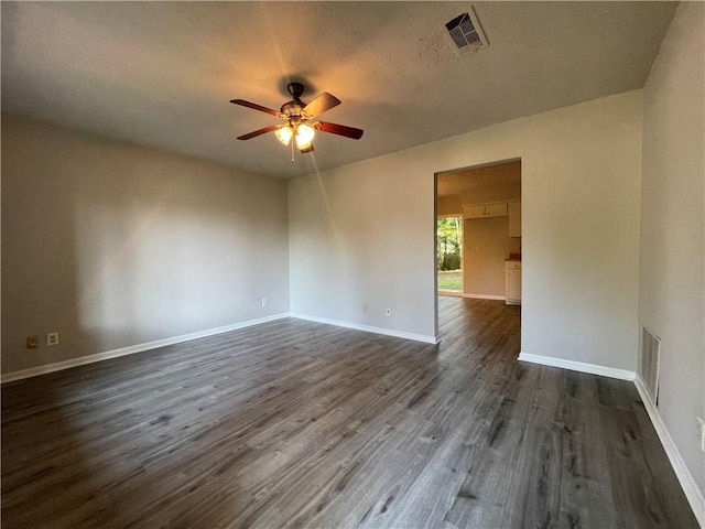 33 Drew Ct, Jonesboro, GA 30238 - unfurnished room featuring ceiling fan, dark wood finished floors, and a textured ceiling