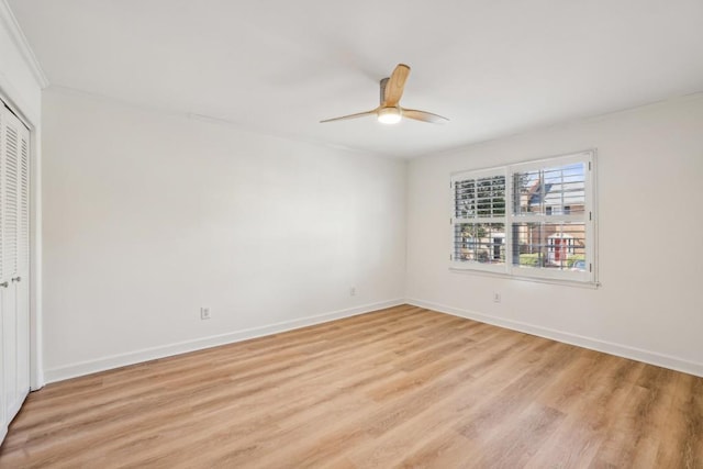 spare room featuring ceiling fan and light hardwood / wood-style floors