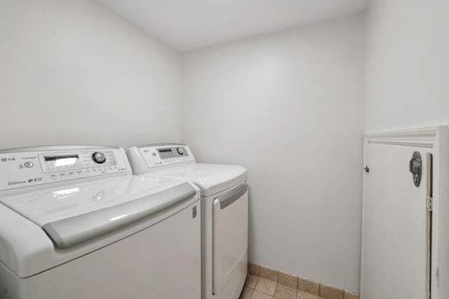 washroom with washing machine and clothes dryer