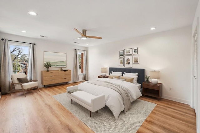 bedroom with ceiling fan and light wood-type flooring