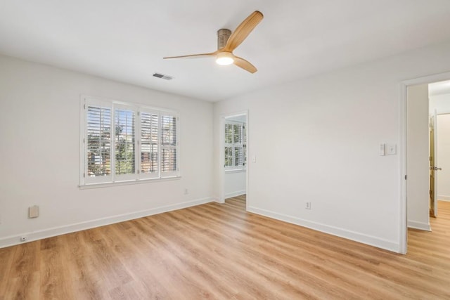 spare room featuring ceiling fan and light hardwood / wood-style floors