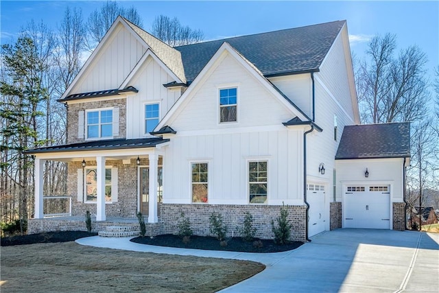 view of front of house featuring board and batten siding, a porch, concrete driveway, and an attached garage