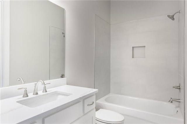 bathroom with toilet, shower / tub combination, and vanity