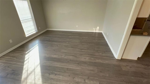 spare room featuring dark hardwood / wood-style floors